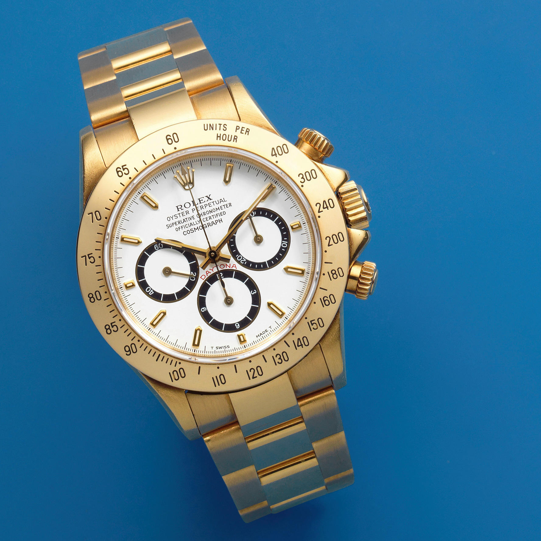 Rolex. An 18K gold automatic chronograph bracelet watch