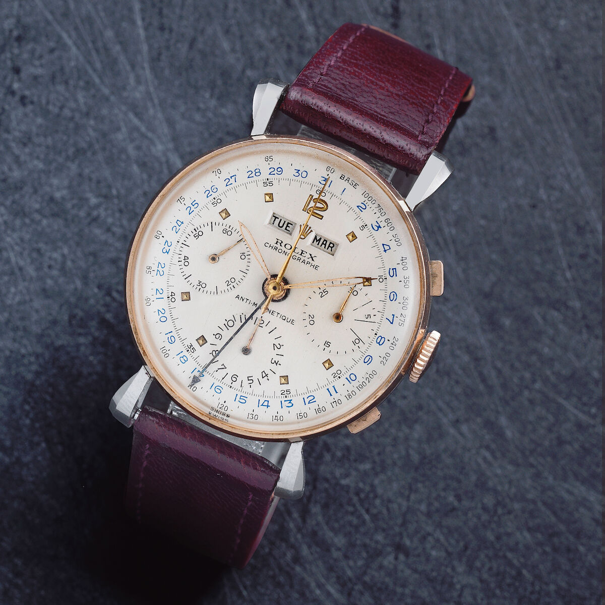 Circa 1948 4768 with rose-gold bezel and pushers on a steel non-Oyster case with flared lugs; silvered dial with square markers, blue calendar ring and day/month windows. · Photo: Bonhams · © Bonhams, used with permission · Source: https://www.bonhams.com/auction/24632/lot/95/rolex-a-rare-stainless-steel-and-rose-gold-manual-wind-triple-calendar-chronograph-wristwatch-ref-4768-circa-1948/