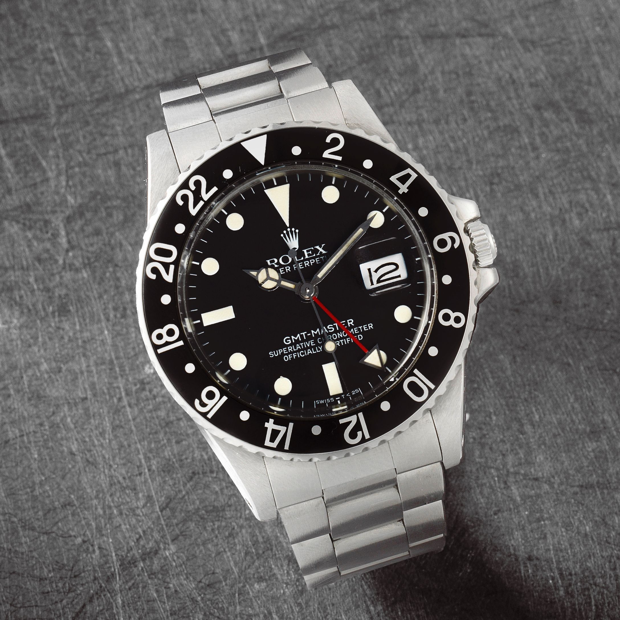 Rolex Rolex. A stainless steel automatic calendar bracelet watch with dual time zone GMT-Master 'Transitional', Ref: 16750, Circa 1981 · 16750