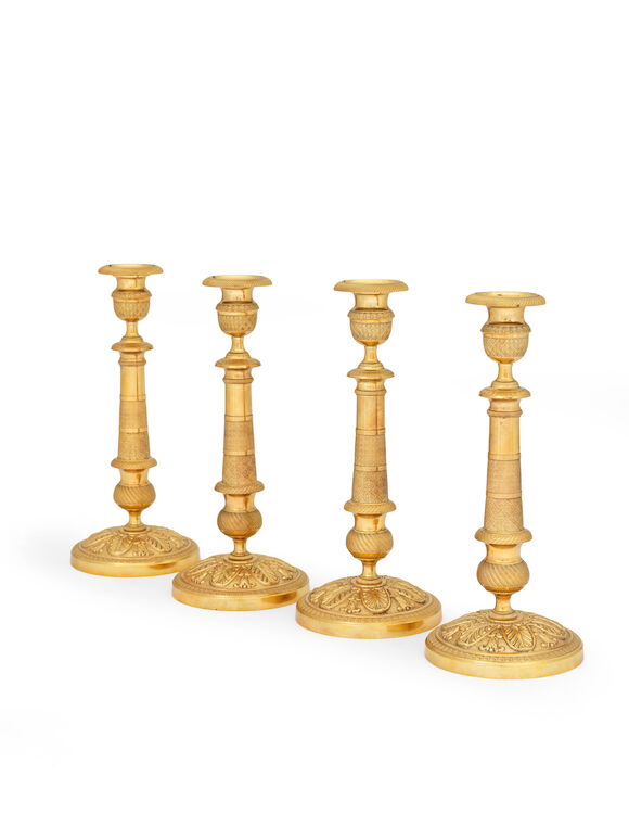 Bonhams : A set of four French gilt bronze candlesticks (4)