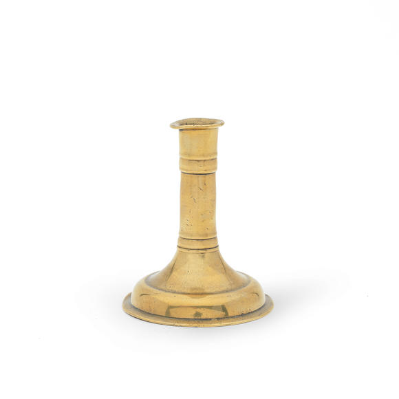 Bonhams : A small mid-17th century trumpet-based brass alloy socket  candlestick, English, circa 1650