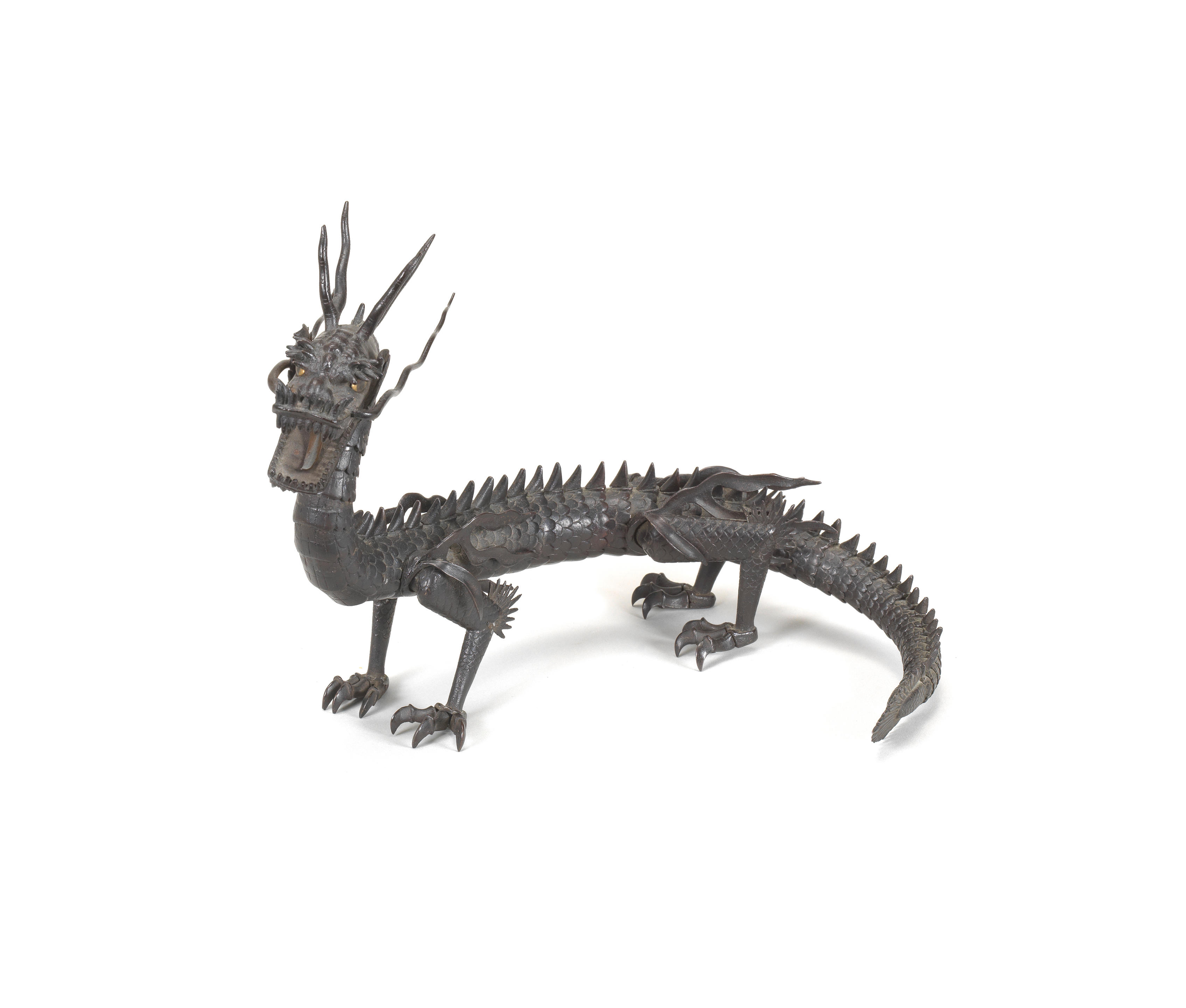 A small iron jizai (articulated) okimono of a dragon