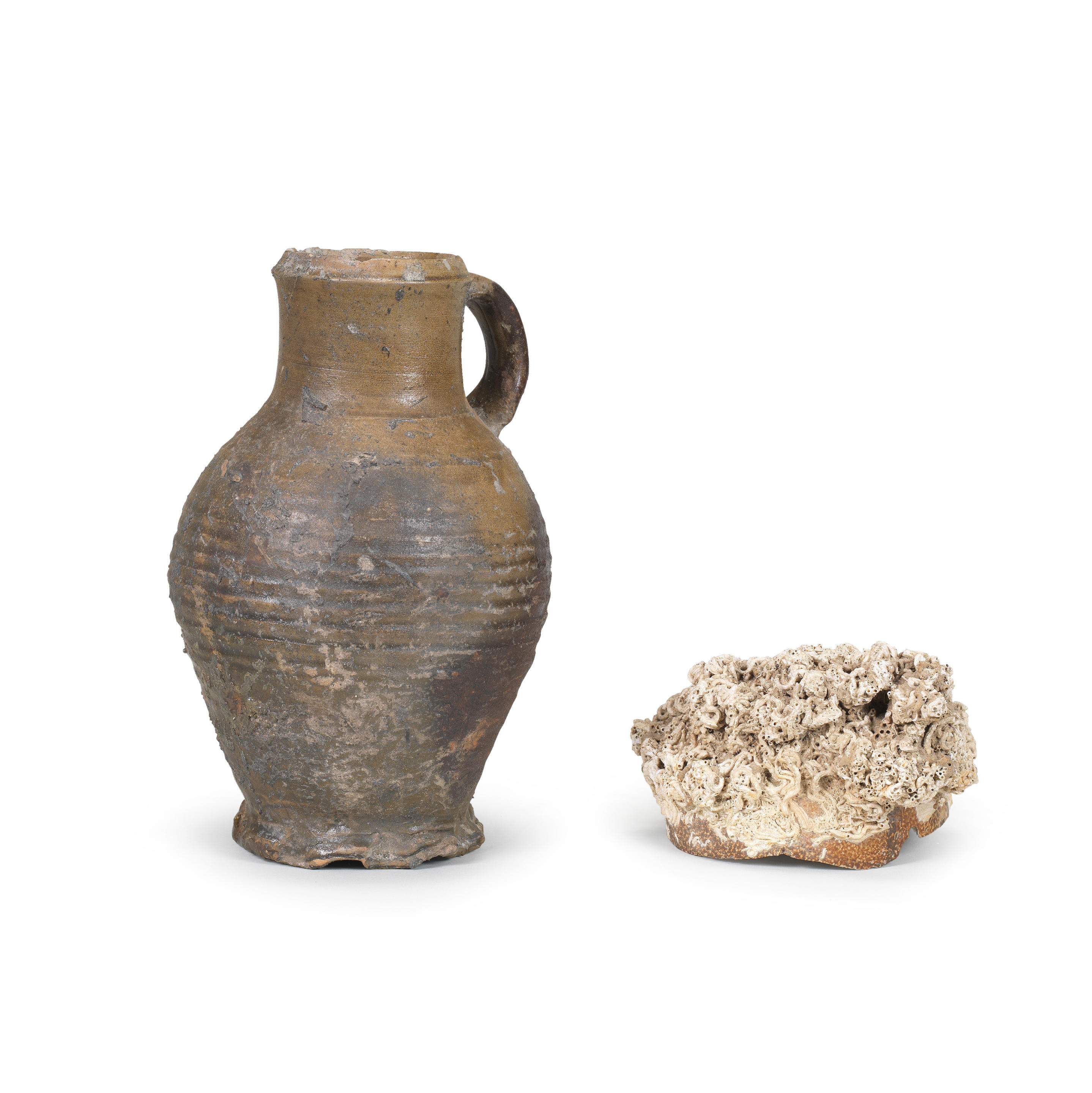 A Rhineland stoneware jug together with an encrusted stoneware shard