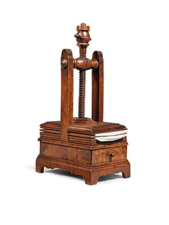 Bonhams : A rare walnut napkin press, English, circa 1730