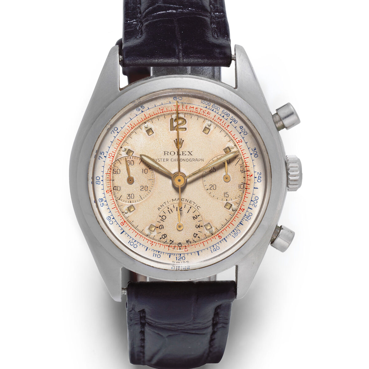 Steel 6034 of circa 1953 in the tonneau Oyster case: silvered dial with applied markers, three registers, red telemeter and blue tachymeter scales. · Photo: Bonhams · © Bonhams, used with permission · Source: https://www.bonhams.com/auction/25399/lot/87/rolex-a-rare-and-well-preserved-stainless-steel-manual-wind-chronograph-wristwatch-anti-magnetic-oyster-chronograph-ref-6034-circa-1953/