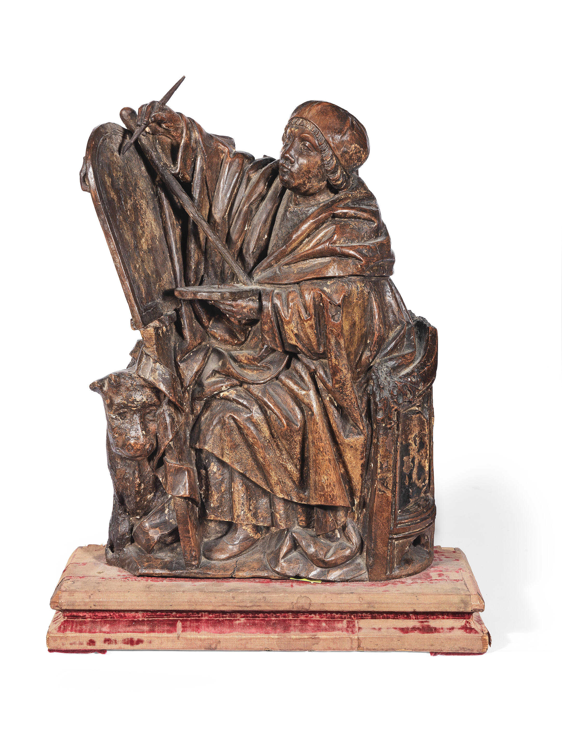 Bonhams A good early 16th century beech carving of St. Luke Painting