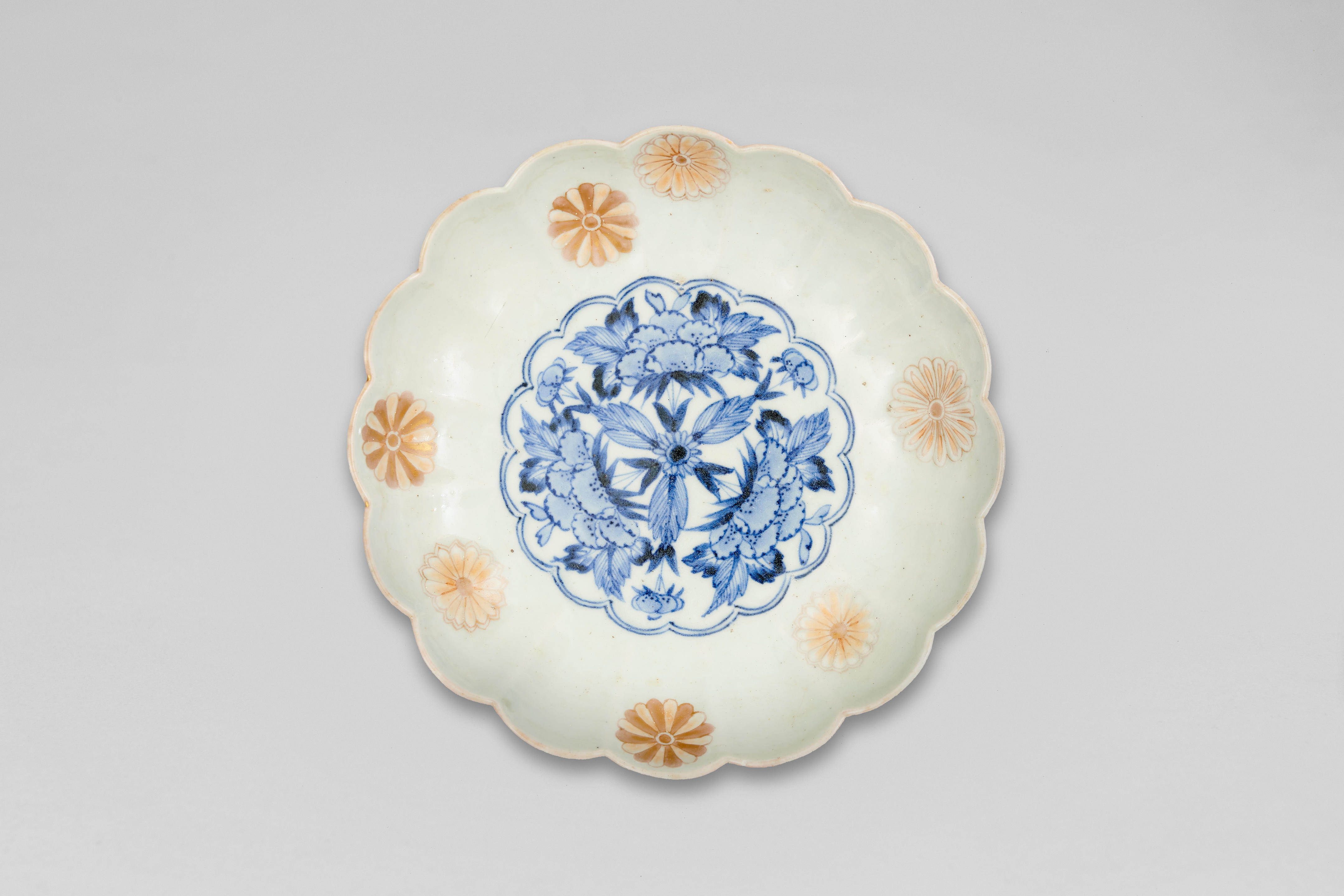 A Japanese blue and white and enamel 'floral' dish