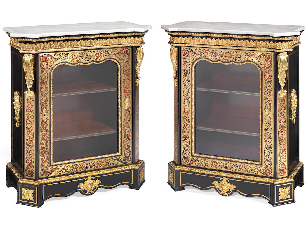 A pair of Napoleon III gilt bronze mounted tortoiseshell and brass 'Boulle' marquetry ebony and ebonised pier cabinets (2)