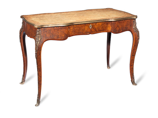 A mid Victorian walnut and marquetry writing table in the Louis XV style