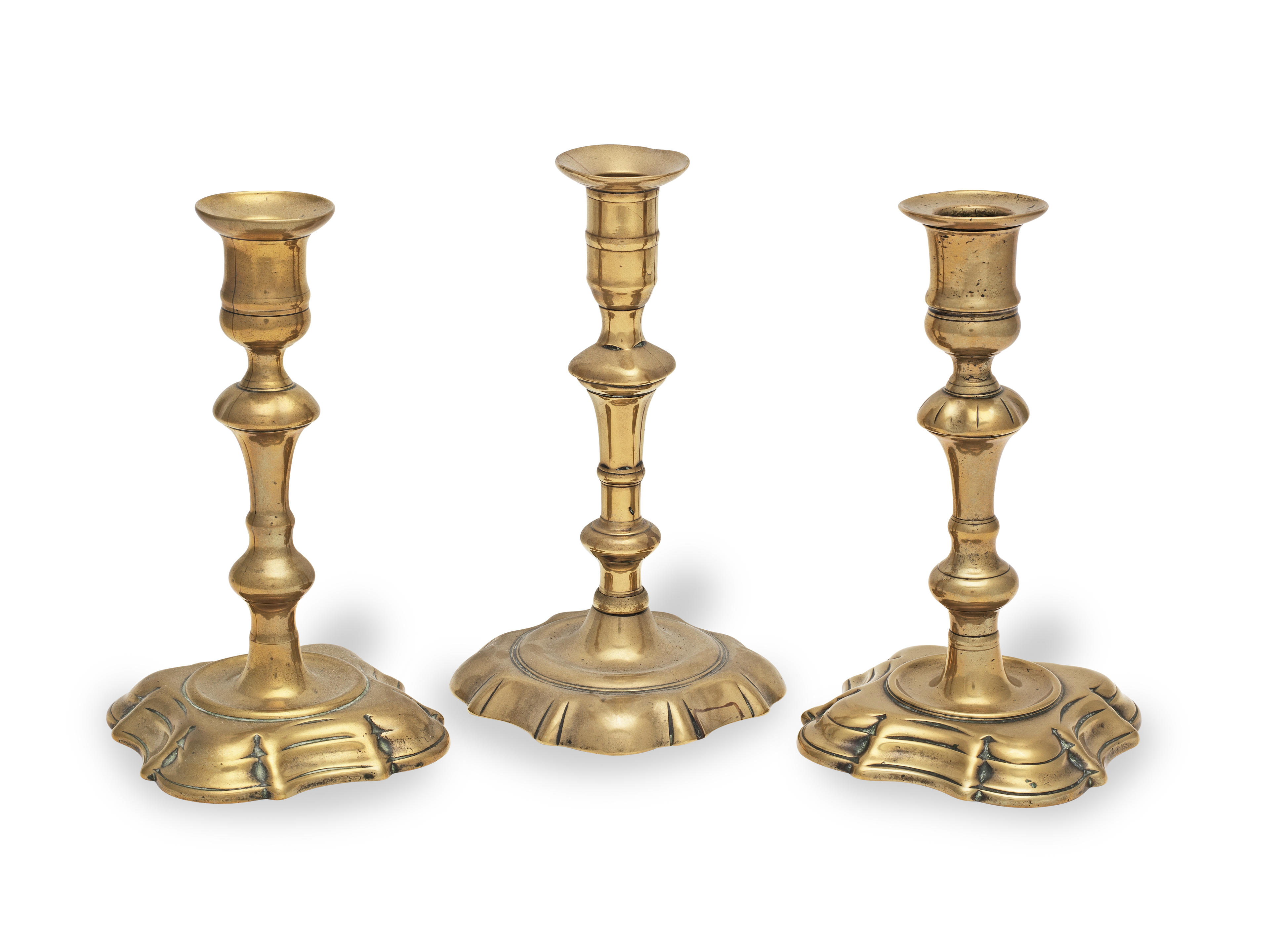 Bonhams : Three George II brass alloy socket candlesticks, circa 1730 ...