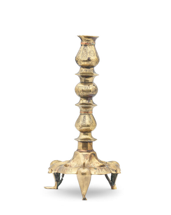 Bonhams A Khorasan bronze lampstand Persia, 12th Century