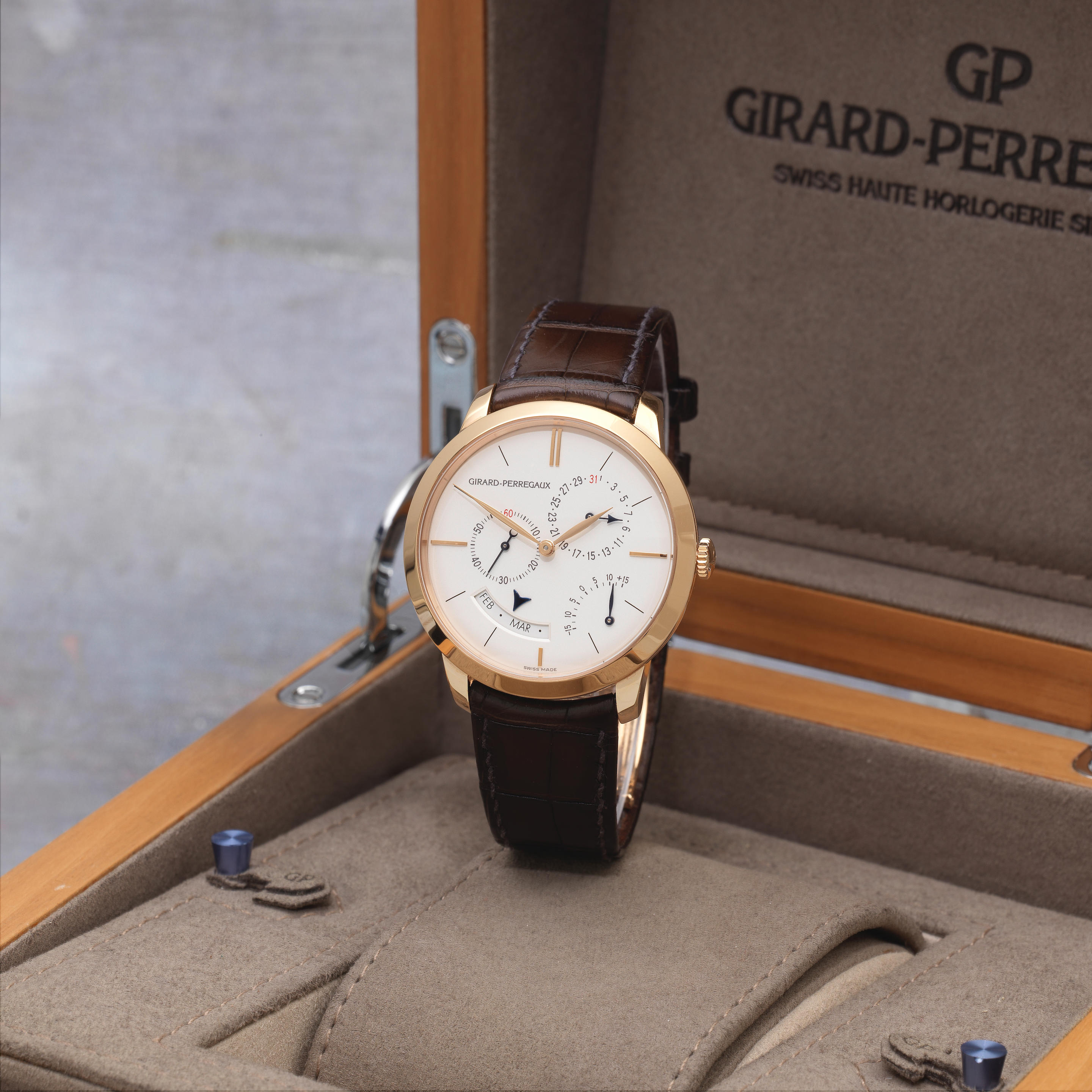 GirardPerregaux. An 18K gold automatic annual calendar wristwatch with