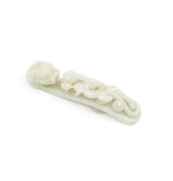 Bonhams : A LARGE PALE GREEN JADE 'DRAGON' BELT HOOK Qing Dynasty