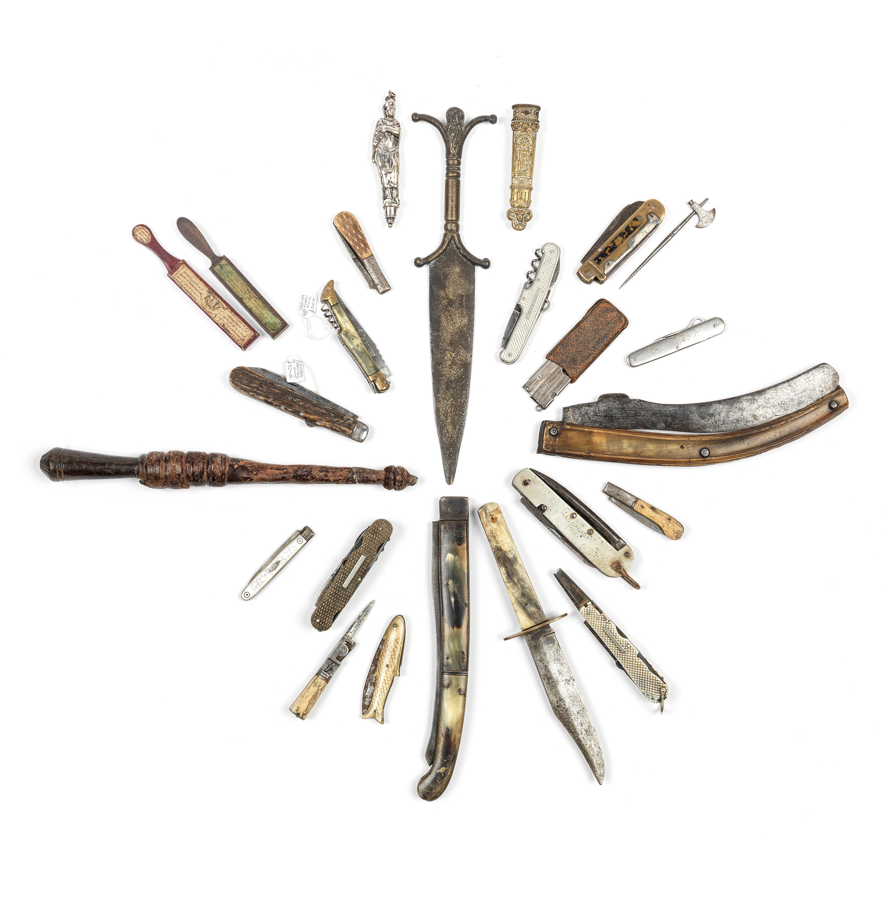 A group of daggers, pocket knives, and related items