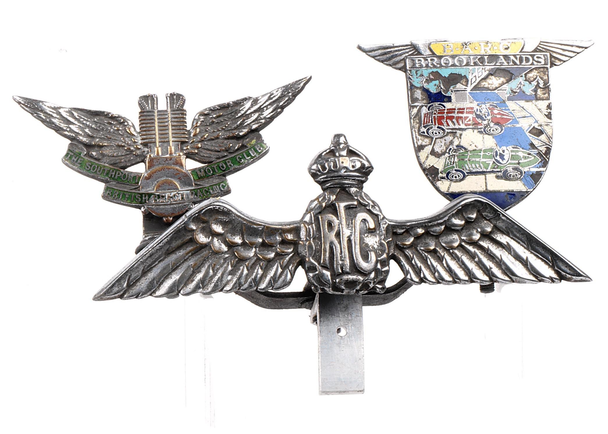 A custom-made badge bar fitted with two badges and a mascot,