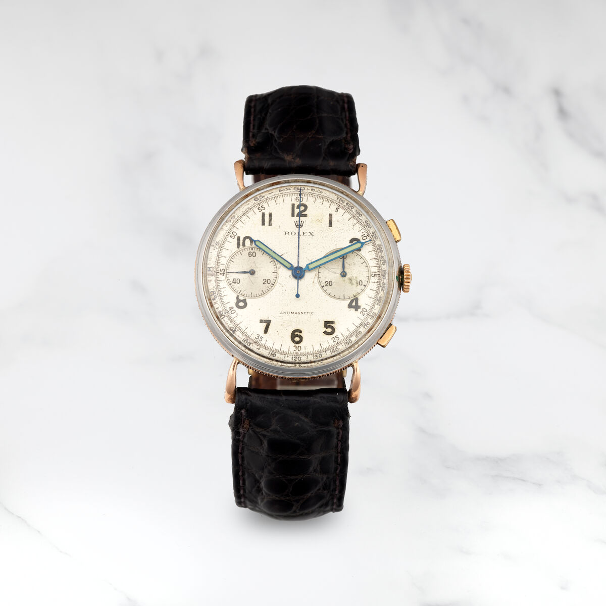 Steel and gilded-metal 4062 with teardrop lugs and a silvered Arabic dial with tachymeter and blued hands. · Photo: Bonhams · © Bonhams, used with permission · Source: https://www.bonhams.com/auction/27299/lot/211/rolex-rare-chronographe-bracelet-en-metal-dore-et-acier-mouvement-mecanique-rolex-a-rare-stainless-steel-and-gilded-metal-manual-wind-chronograph-wristwatch-antimagnetic-ref-4062-circa-1938/