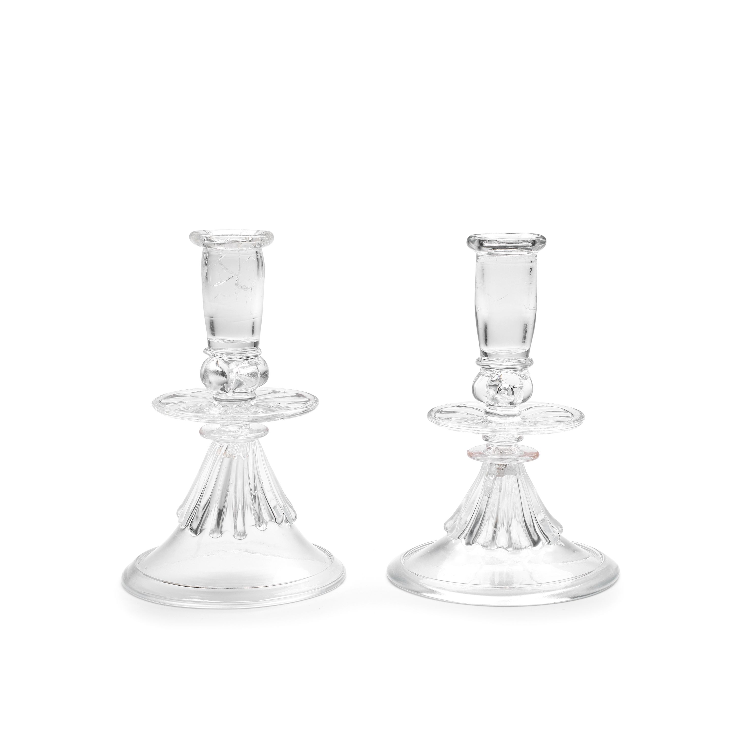 A rare pair of early glass candlesticks, probably French, late 17th