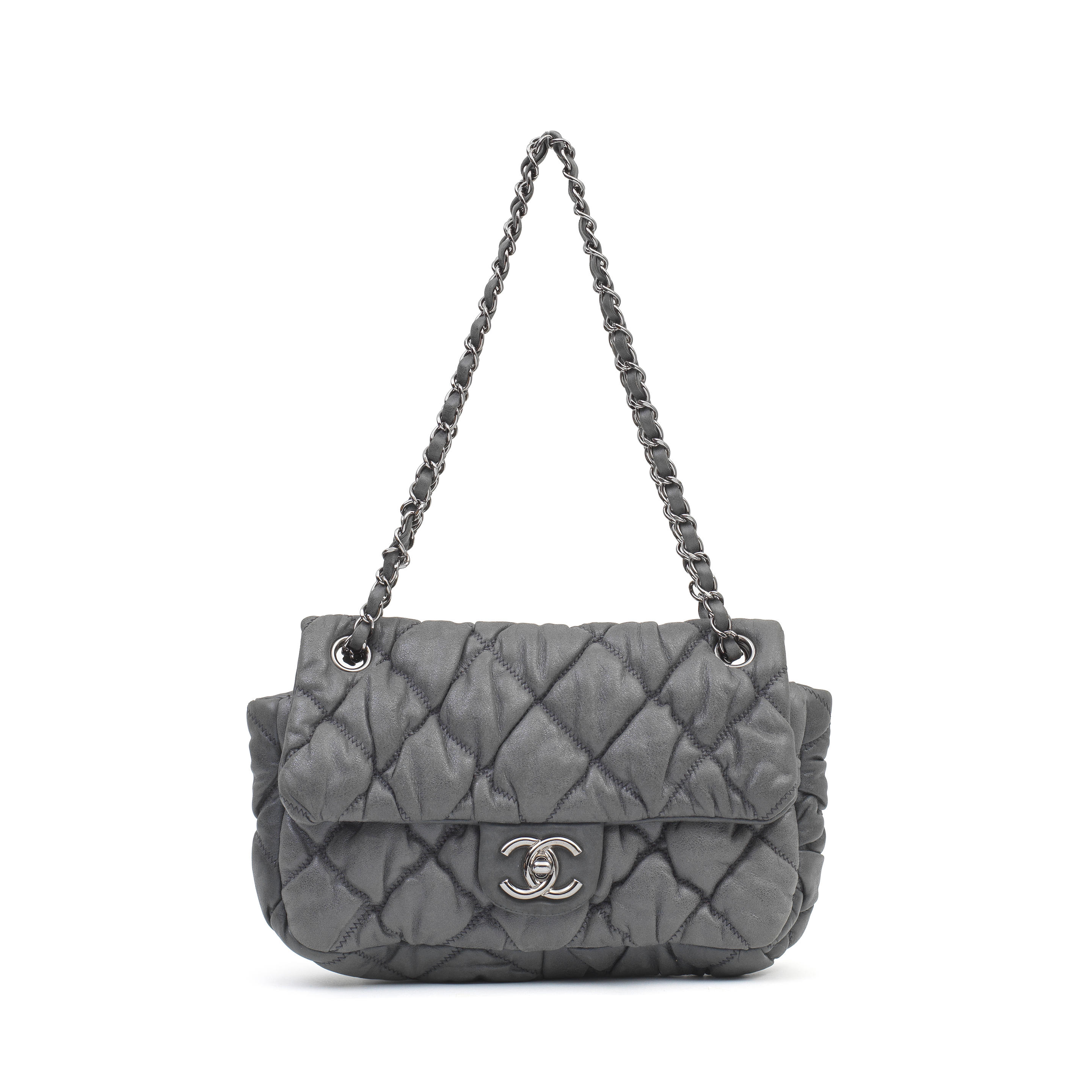 Sold at Auction: A Chanel navy quilted lambskin leather flap bag, 1980s