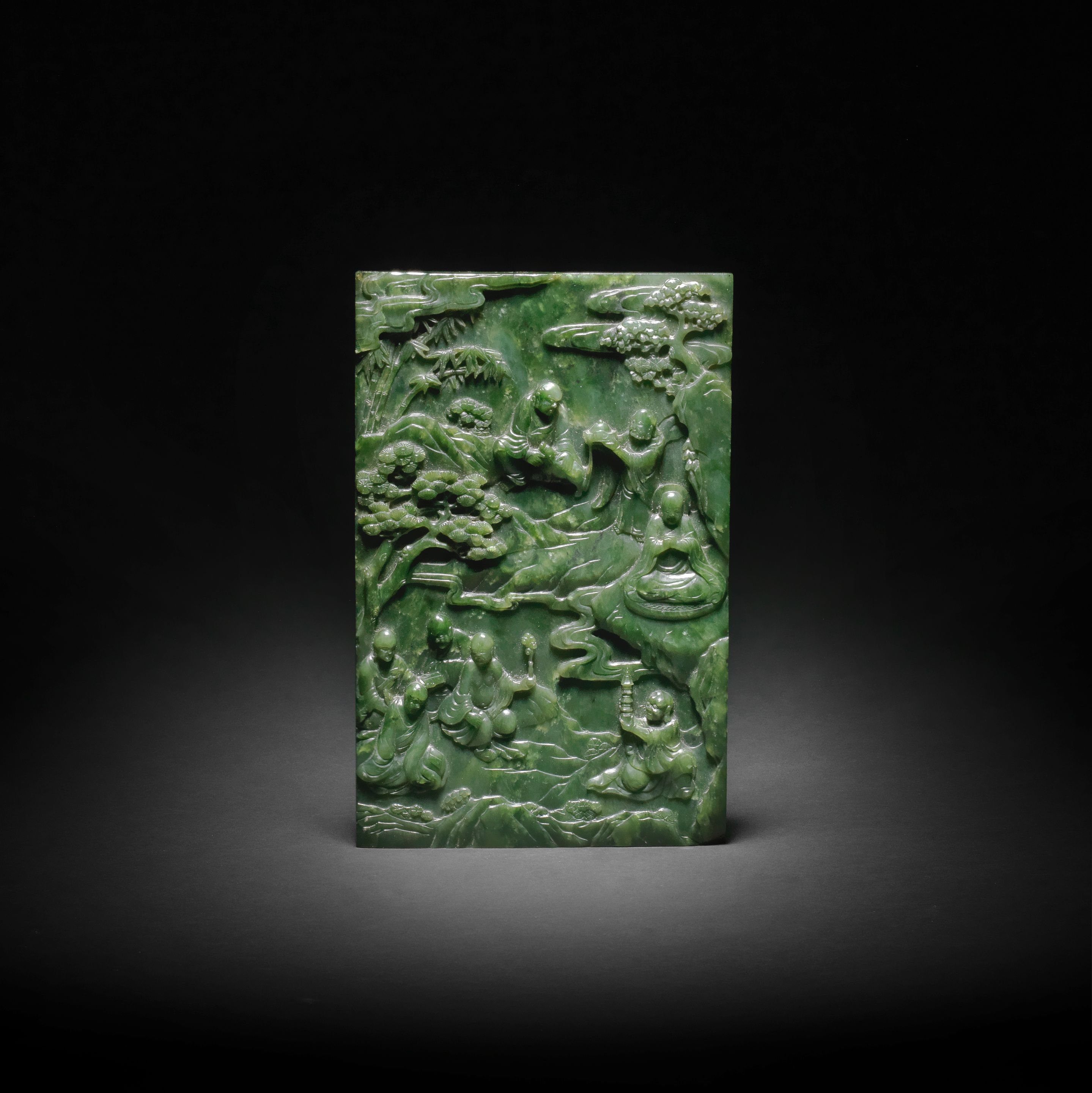 A RARE AND FINE SPINACHGREEN JADE CARVED 'EIGHT LUOHANS' TABLE SCREEN