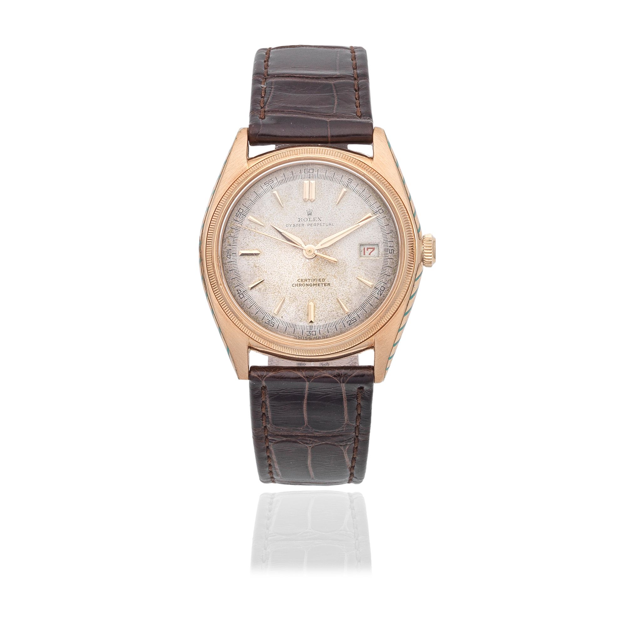 Bonhams An 18K gold automatic calendar bubble back