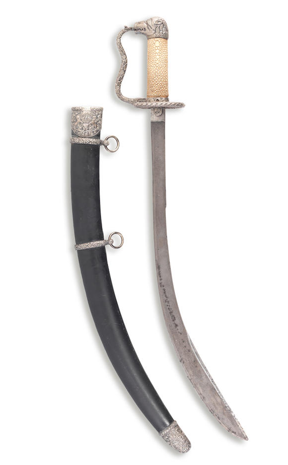 Bonhams : A rare silver-mounted steel cutlass with the arms of the ...