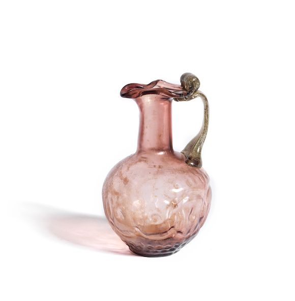 Bonhams : A Roman pale purple glass jug