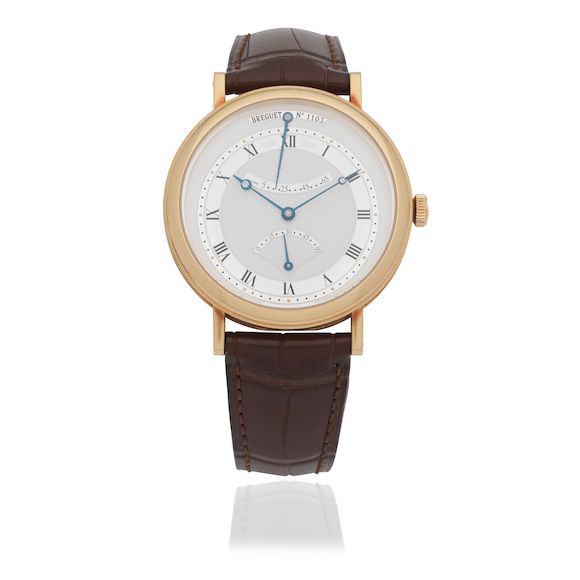 Bonhams An 18K gold automatic wristwatch with power