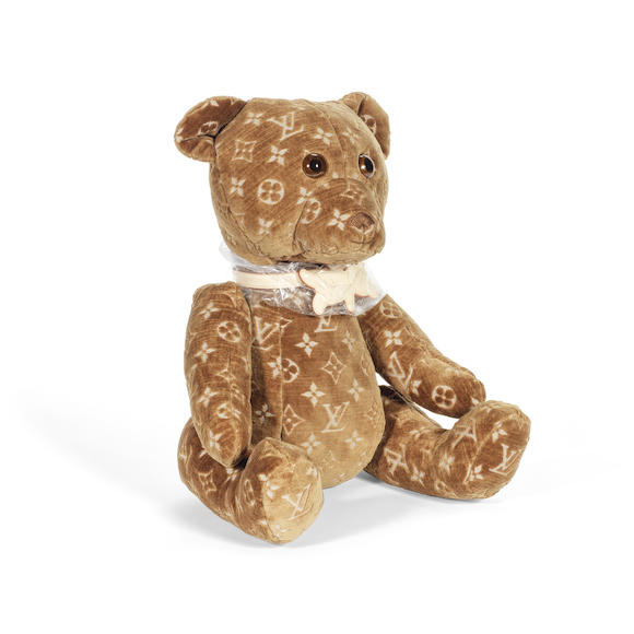 London, UK. 6th Mar, 2023. Louis Vuitton luggage and a DouDou 2005 & 2020  Teddy Bear, Limited edition 2021, est £2,600 - £3,200Preview of Bonhams'  Designer Handbags and Fashion sale at the