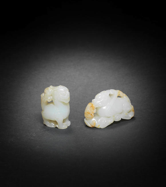 Bonhams : TWO WHITE JADE CARVINGS OF MYTHICAL BEASTS (3)