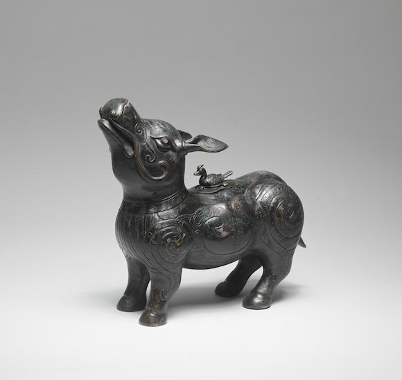 Bonhams : A RARE GOLD AND SILVER-INLAID BRONZE TAPIR-SHAPED VESSEL AND ...