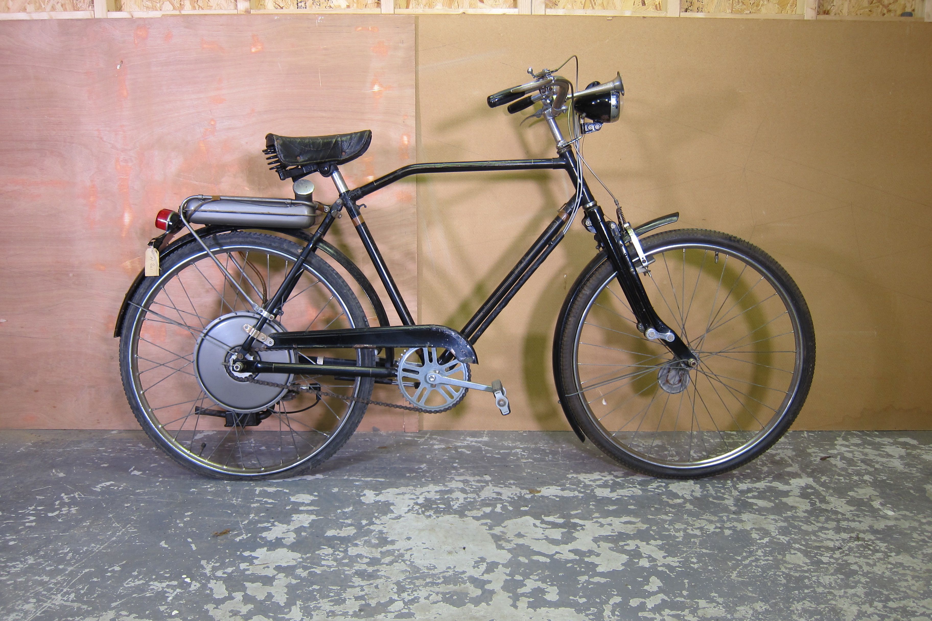 Bonhams Cars A BSA bicycle with Winged Wheel motor attachment