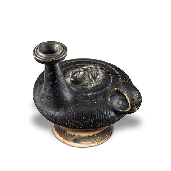 Bonhams : A large Greek Calene ware black glazed guttus