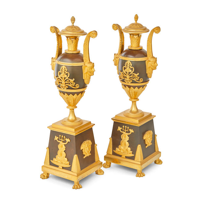 A pair of Empire gilt and patinated bronze retour d'Egypte garniture vases and coversEarly 19th century