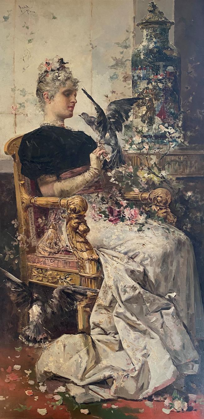 Salvador Sánchez Barbudo(Spanish, 1857-1917)An elegant lady seated in an interior