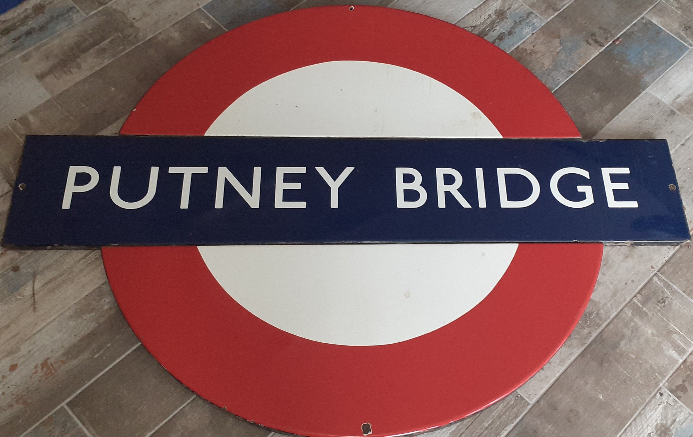 Bonhams Cars Putney Bridge, a London Underground 56 inch enamel sign,
