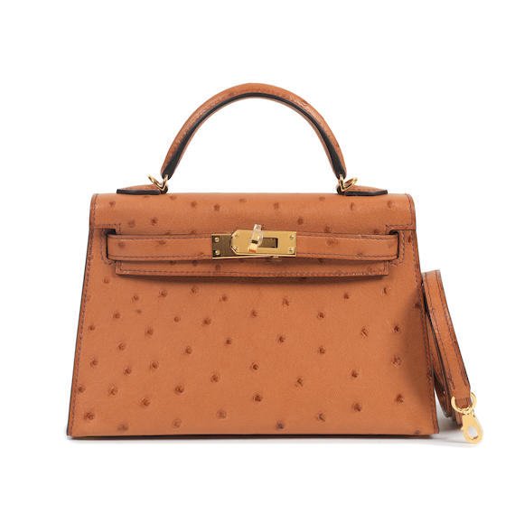 Bonhams : Hermès a Cognac Ostrich Mini Kelly II 20 2021 (includes shoulder  strap, felt protector, dust bags, booklet and box)