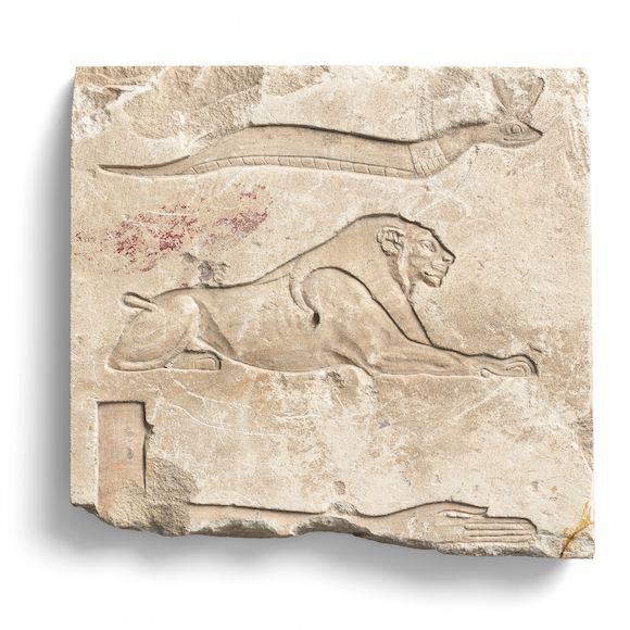 Bonhams : An Egyptian limestone relief fragment with lion hieroglyph