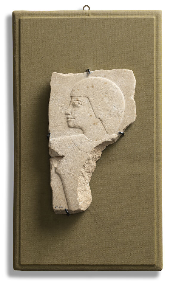 Bonhams : An Egyptian limestone relief fragment with male head