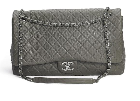 Bonhams : Chanel A Filigree backpack of black quilted Caviar leather with  gold tone hardware and two adjustable straps.