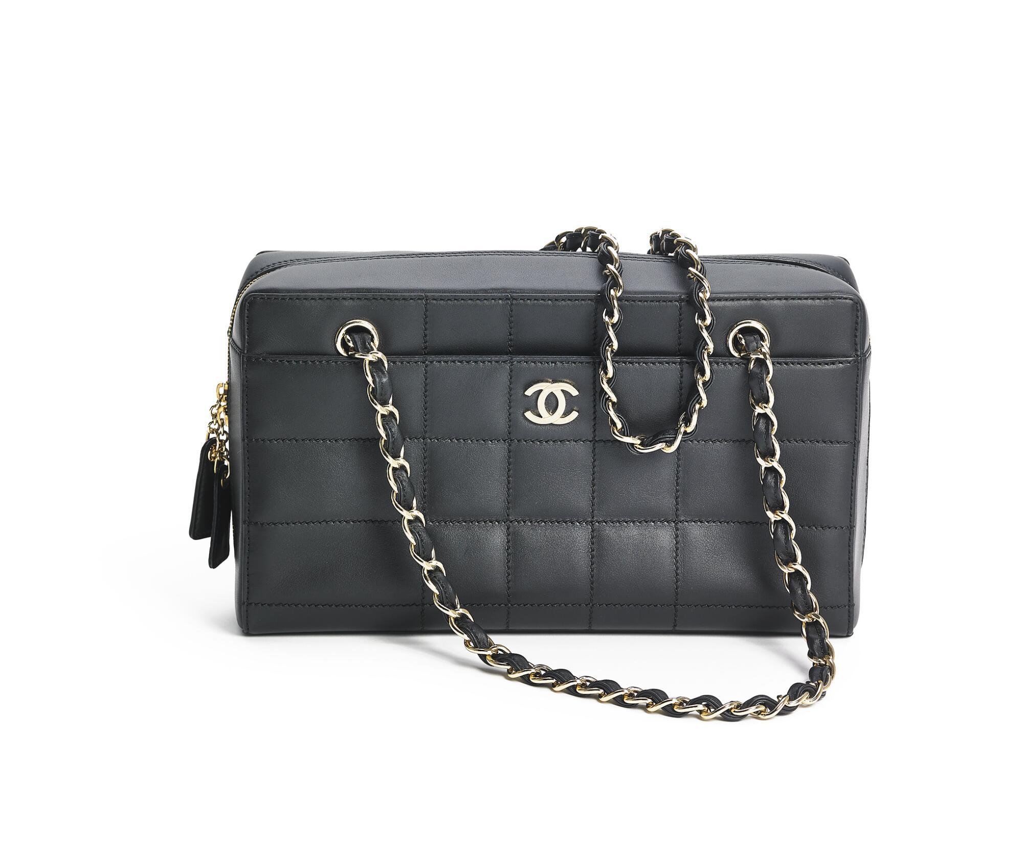 Bonhams : Chanel A bag of black quilted leather with gold tone hardware, two  chain straps and one exterior front pocket.