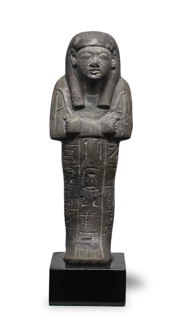 Bonhams : A large Egyptian grey stone shabti for the Singer of Amun