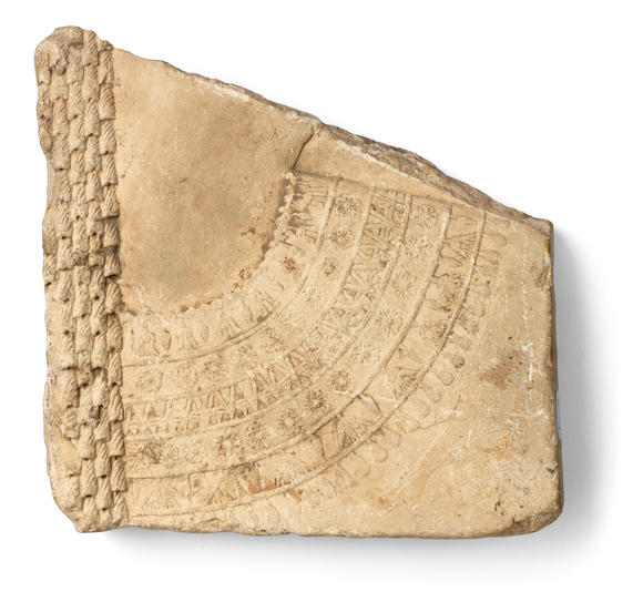 Bonhams : An Egyptian limestone relief fragment of a queen or goddess