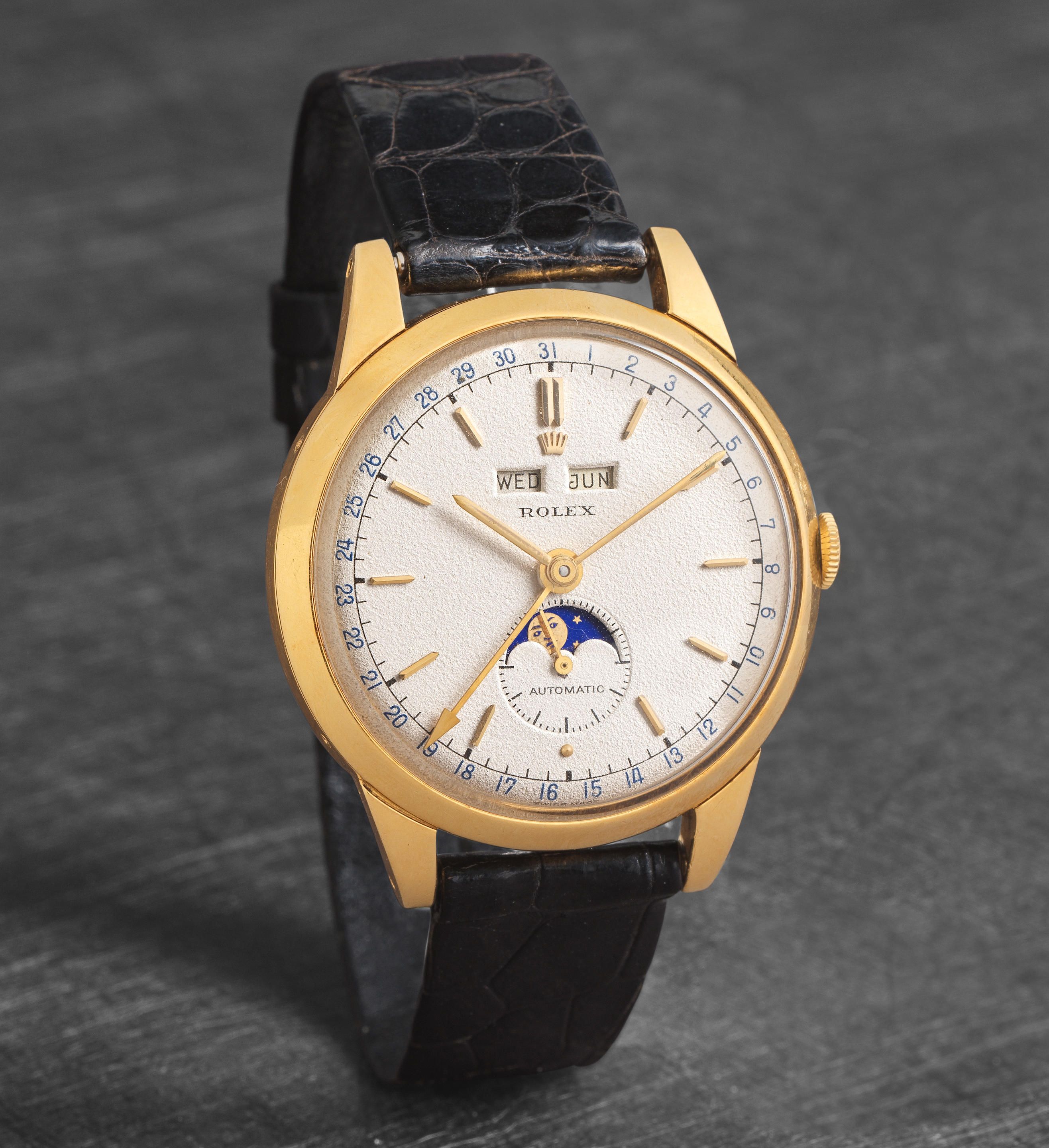 Bonhams : Rolex. A very rare 18K gold automatic triple calendar