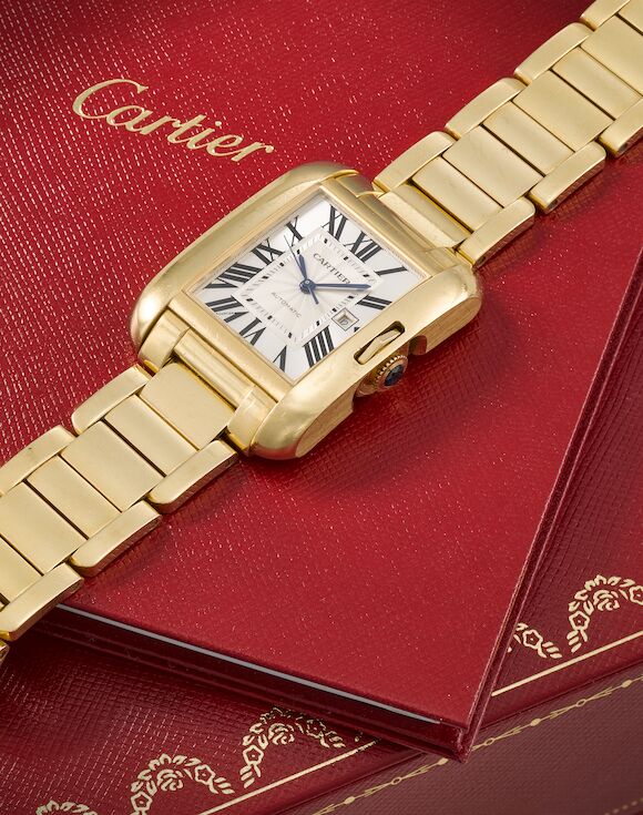 Bonhams : Cartier. An 18K gold automatic calendar bracelet watch Tank ...