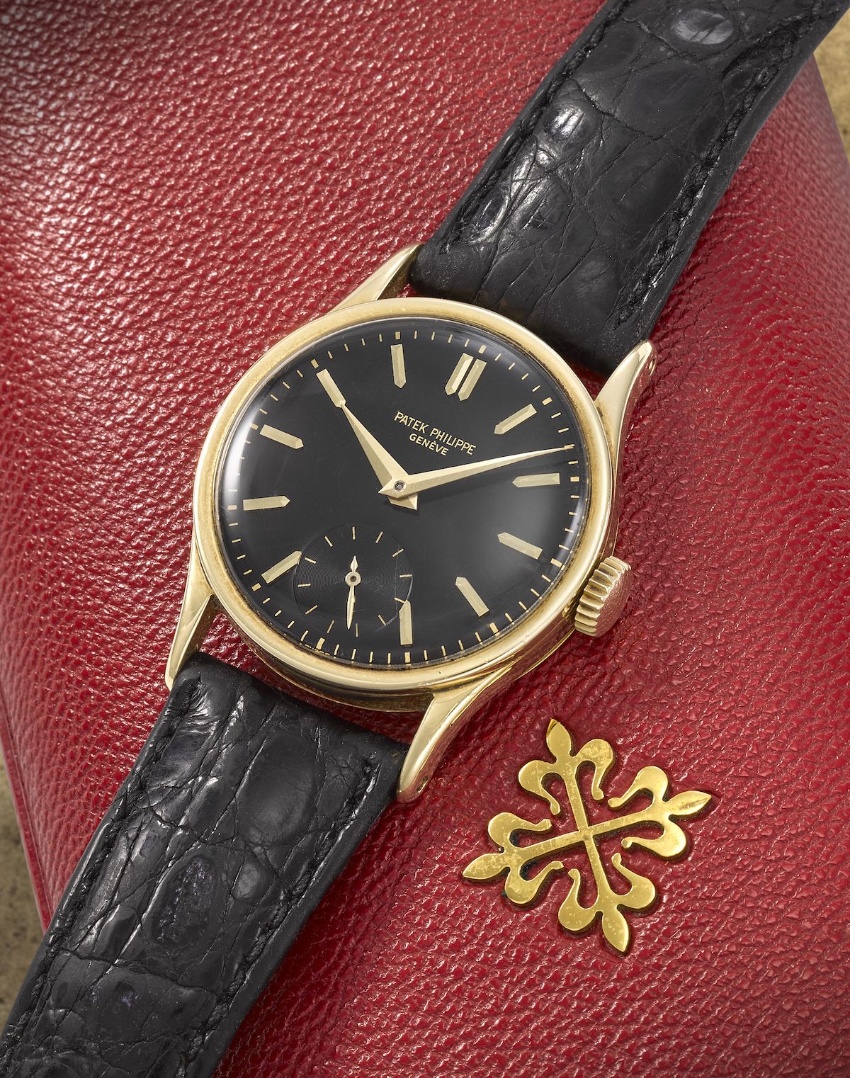 Yellow-gold ref. 96 with glossy black dial, applied gilt dart markers, gilt lance hands and small seconds at 6. · Photo: Bonhams · © Bonhams, used with permission · Source: https://www.bonhams.com/auction/30667/lot/32/patek-philippe-a-fine-18k-gold-manual-wind-wristwatch-with-rare-black-dial-calatrava-ref-96-circa-1960/