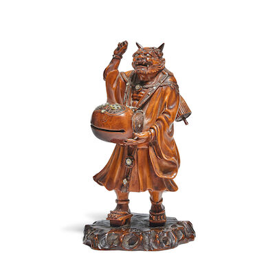 A BOXWOOD OKIMONO OF AN ONI Meiji period