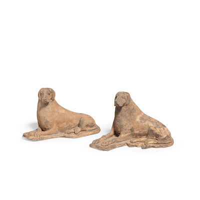 A PAIR OF POTTERY MODELS OF RECUMBENT HOUNDS Eastern Wei Dynasty (2)