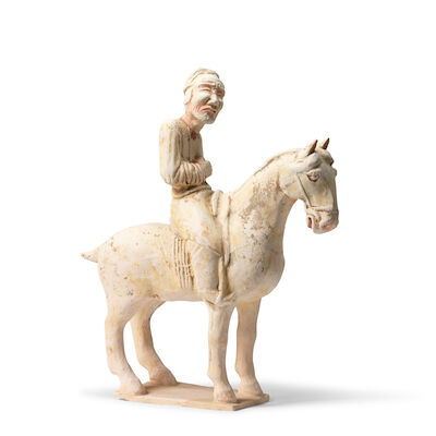 A PAINTED POTTERY EQUESTRIAN FIGURE Tang Dynasty