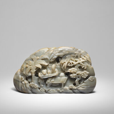 A MASSIVE GREYISH-GREEN AND RUSSET JADE 'SCHOLAR PRACTISING CALLIGRAPHY ON A LEAF' BOULDER 17th/18th century (2)