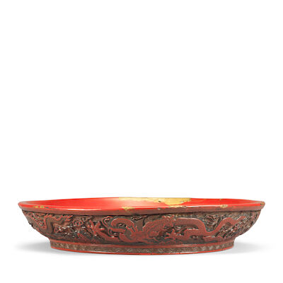 A RARE CARVED THREE-COLOUR LACQUER 'DRAGON' DISH Jiajing six-character mark and of the period